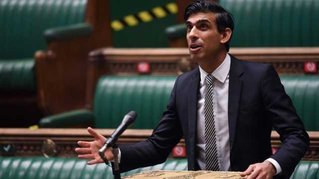 A handout photograph released by the UK Parliament shows Britain's Chancellor of the Exchequer Rishi Sunak speaking on the Treasurys emergency COVID-19 support measures, in a socially distanced, hybrid session of the House of Commons in London on January 11, 2021. - British finance minister Rishi Sunak said Monday that the coronavirus-ravaged economy would get worse before it recovers amid warnings that more than 250,000 small firms could go bust this year. "Coronavirus has already caused significant harm to our economy," Sunak told parliament, noting that it total output was 6.1 percent smaller than before the health crisis erupted last year and sparked a historic recession. (Photo by JESSICA TAYLOR / UK PARLIAMENT / AFP) / RESTRICTED TO EDITORIAL USE - MANDATORY CREDIT " AFP PHOTO / UK PARLIAMENT / JESSICA TAYLOR " - NO USE FOR ENTERTAINMENT, SATIRICAL, MARKETING OR ADVERTISING CAMPAIGNS - EDITORS NOTE THE IMAGE HAS BEEN DIGITALLY ALTERED AT SOURCE TO OBSCURE VISIBLE DOCUMENTS /  (Photo by JESSICA TAYLOR/UK PARLIAMENT/AFP via Getty Images)